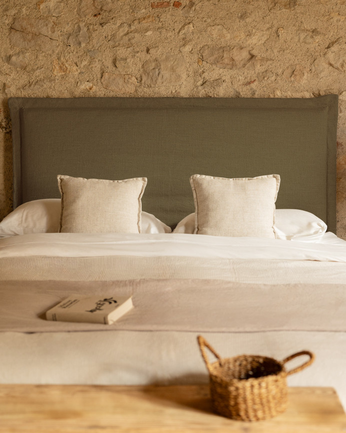 Upholstered green linen headboard with removable cover, available in various sizes.