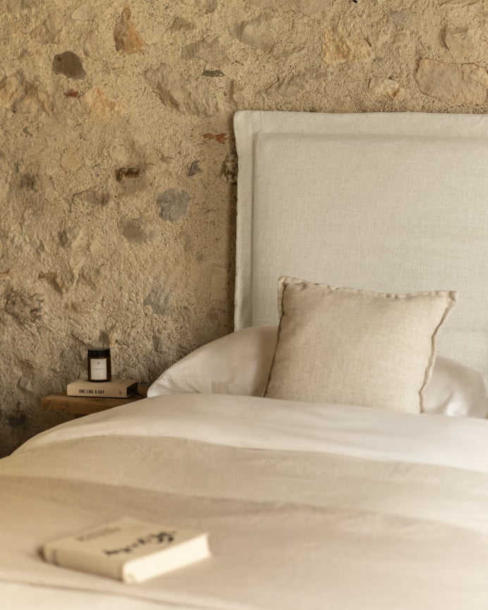 Upholstered headboard with removable white linen cover in various sizes.