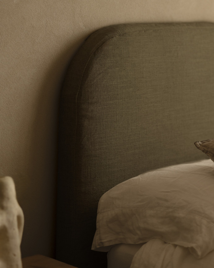 Upholstered headboard in removable green linen in various sizes.