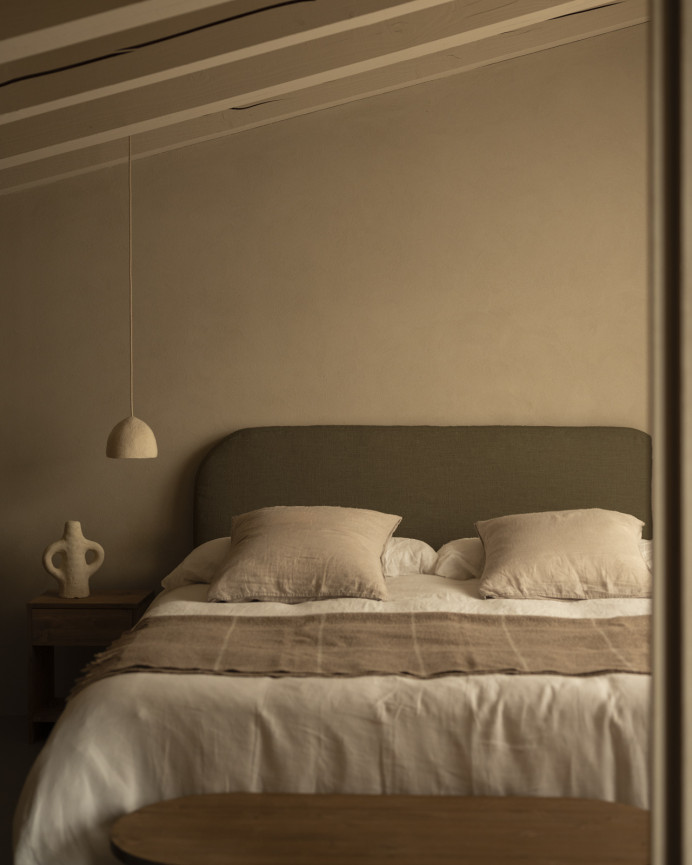 Upholstered headboard in removable green linen in various sizes.