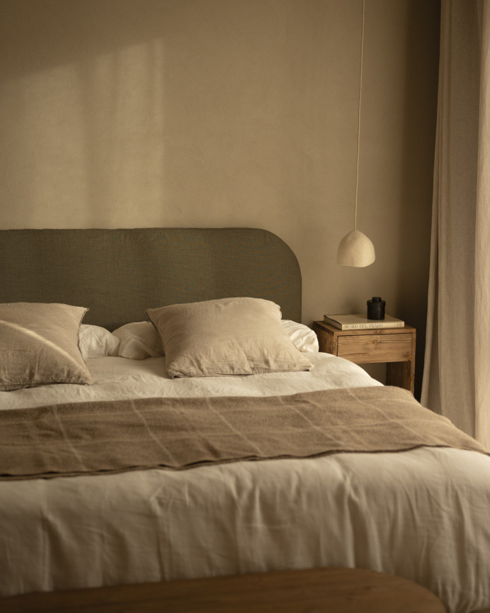 Upholstered headboard in removable green linen in various sizes.