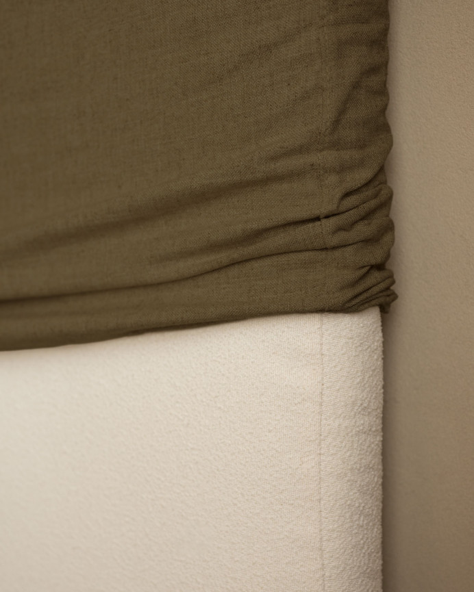 Upholstered headboard in removable green linen in various sizes.
