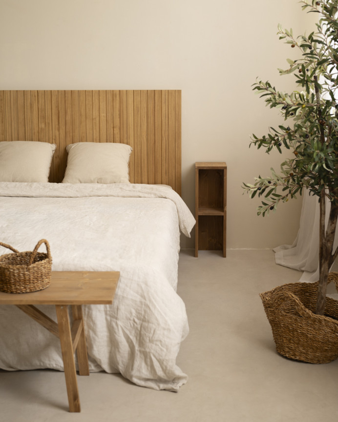 Slotted solid wood headboard in medium oak tone in various sizes.