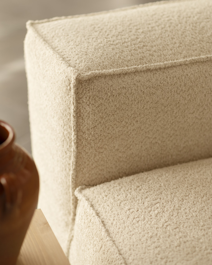 Off-white bouclé armchair measuring 110x90cm.