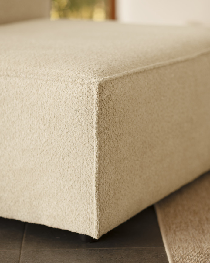 Off-white bouclé armchair measuring 110x90cm.