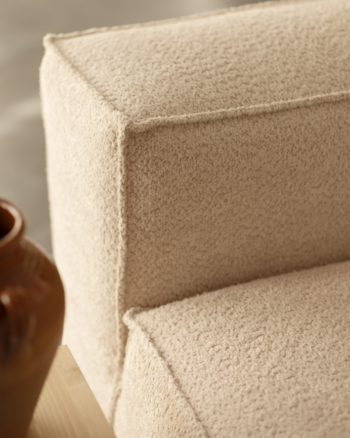 Beige bouclé armchair measuring 110x90cm