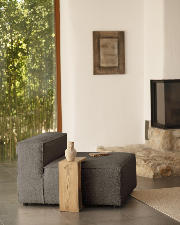 Dark gray bouclé armchair measuring 110x90cm.