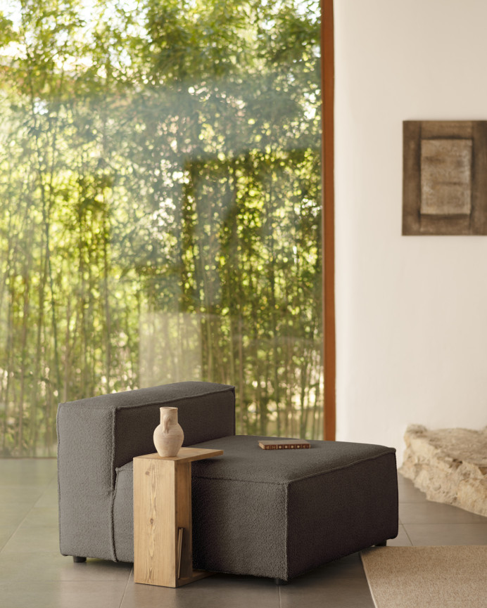 Dark gray bouclé armchair measuring 110x90cm.