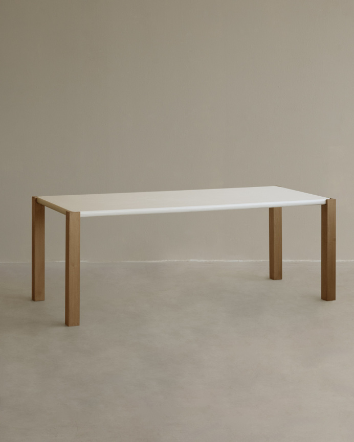 Rectangular dining table in a matte off-white tone and poplar wood legs in various sizes.