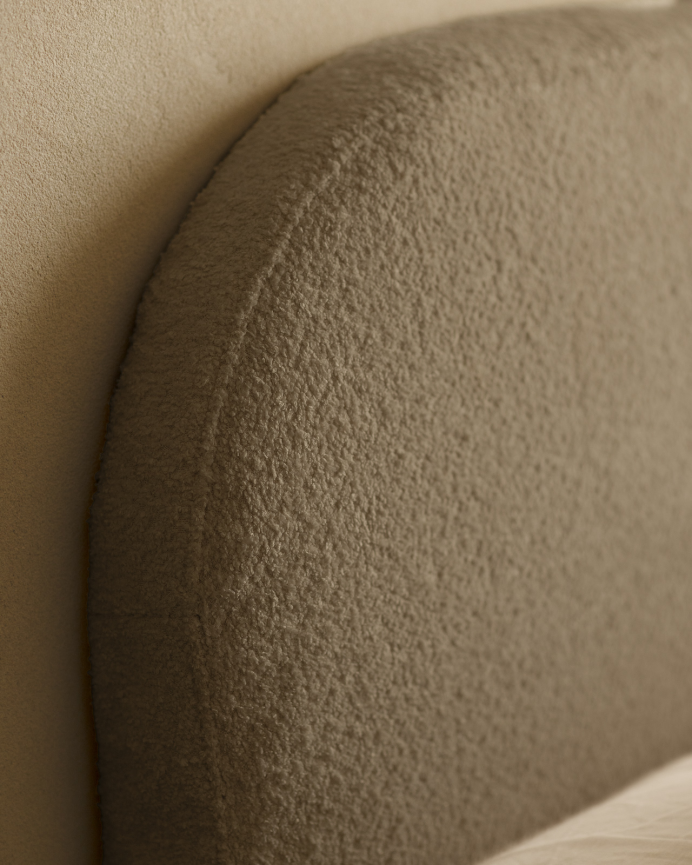 Upholstered headboard in removable brown bouclé fabric in various sizes.