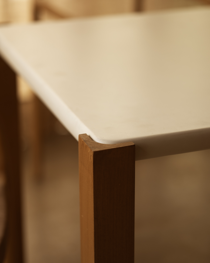 Rectangular dining table in a matte off-white tone and poplar wood legs in various sizes.