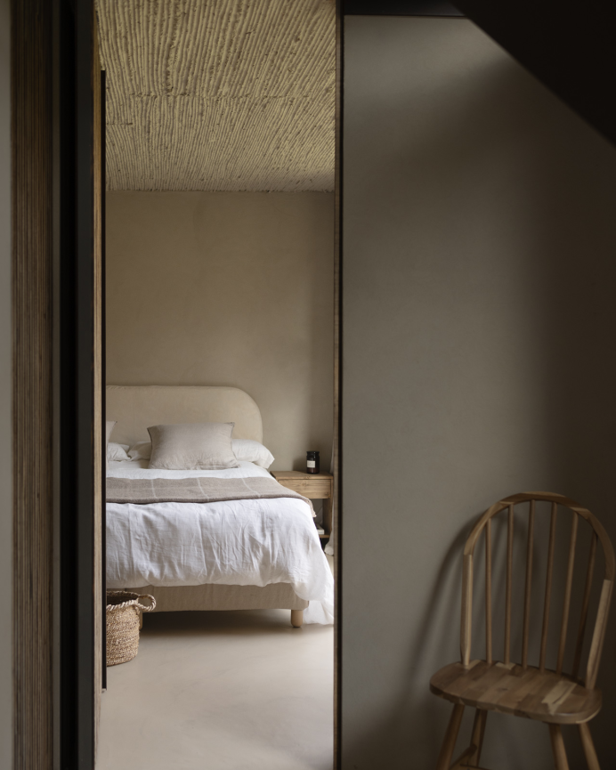 Upholstered headboard with removable beige corduroy cover in various sizes.