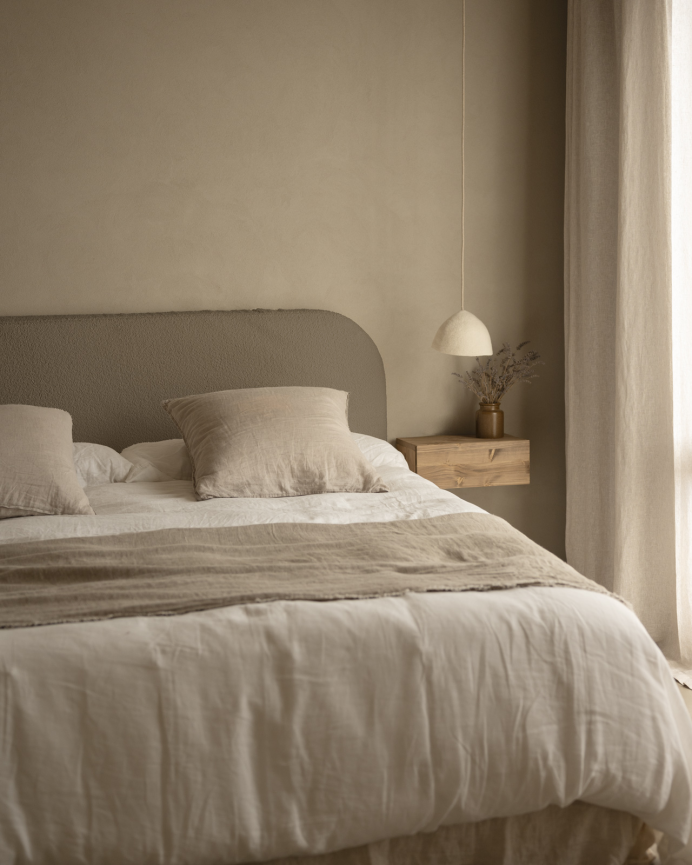 Upholstered headboard in removable brown bouclé fabric in various sizes.