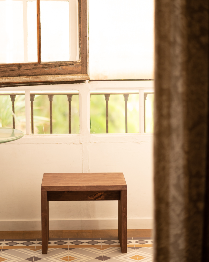 Small / Solid wood stool in walnut tone measuring 45x50cm