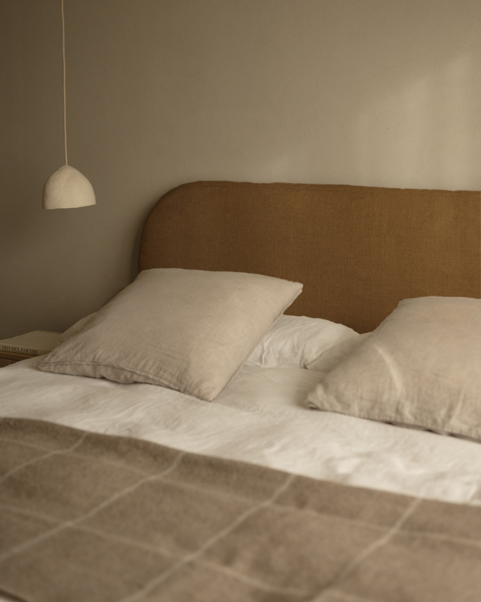 Removable linen upholstered headboard in terracotta in various sizes.