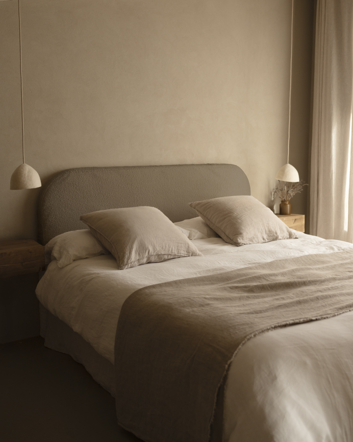 Upholstered headboard in removable brown bouclé fabric in various sizes.