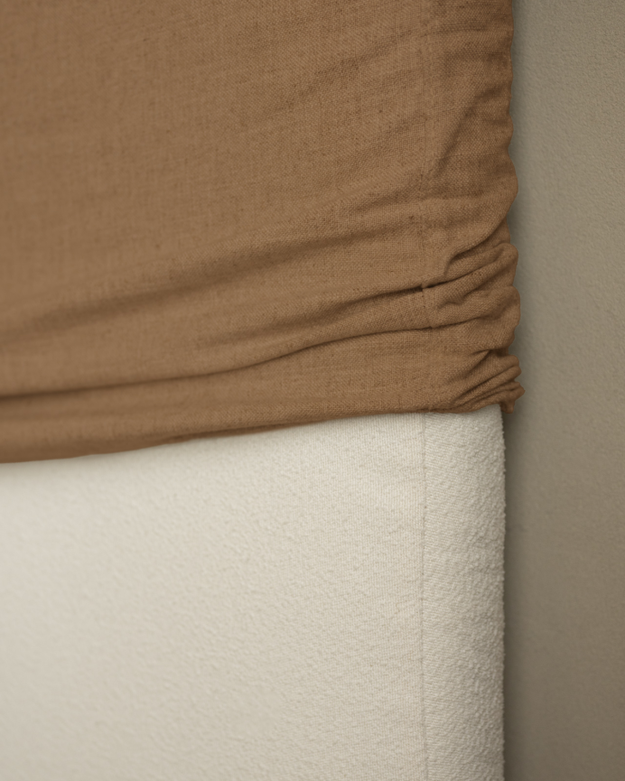 Removable linen upholstered headboard in terracotta in various sizes.