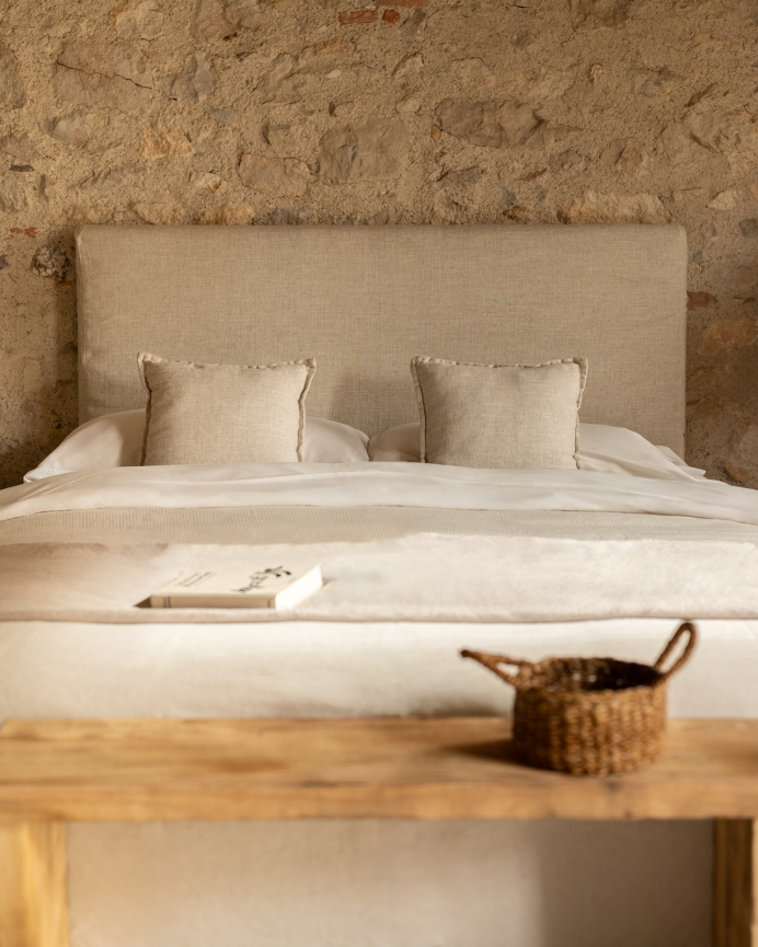 Upholstered beige linen headboard with removable cover in various sizes.