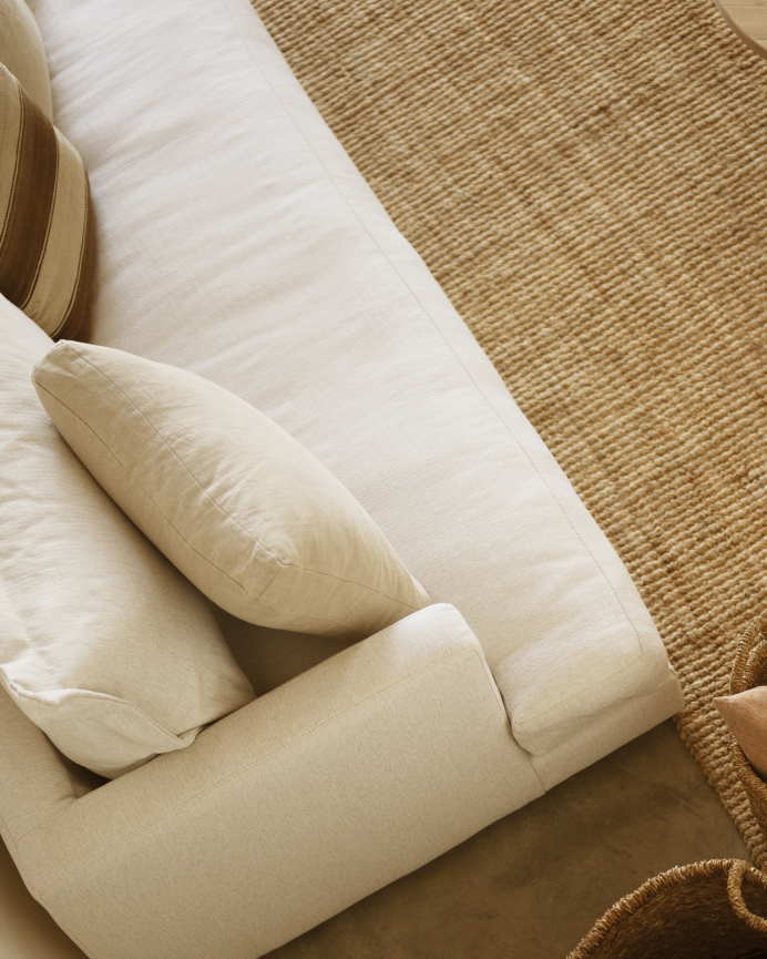 Straight sofa in off-white tone measuring 215x105cm.