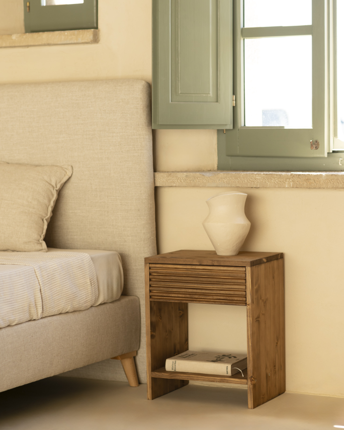 Solid wood bedside table with one drawer in a dark oak tone of various sizes.