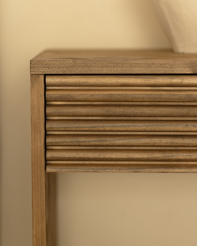 Solid wood bedside table with one drawer in a dark oak tone of various sizes.