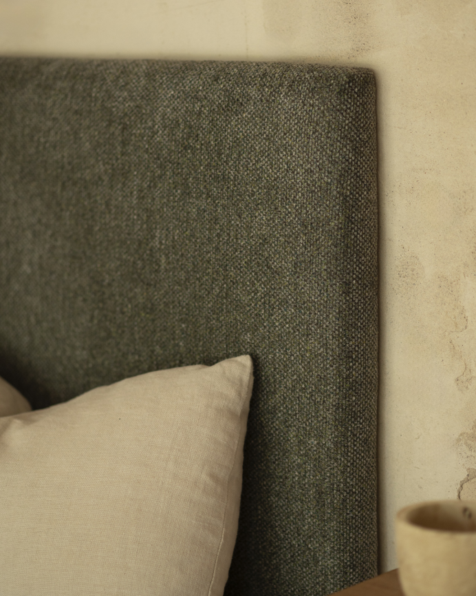 Upholstered headboard in green color, available in various sizes.