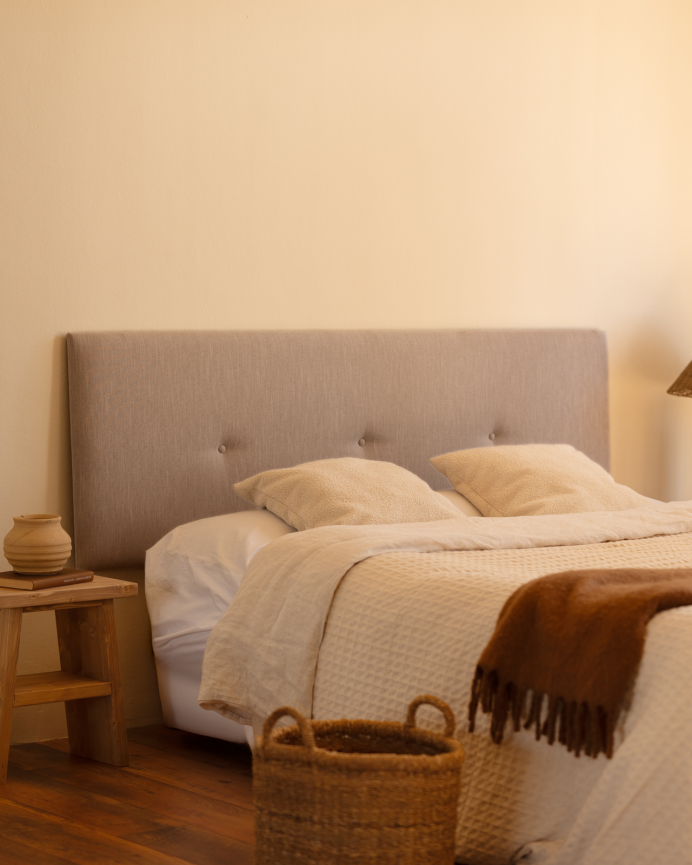 Upholstered polyester headboard with cinnamon-colored buttons available in various sizes.