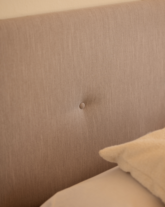 Upholstered polyester headboard with cinnamon-colored buttons available in various sizes.