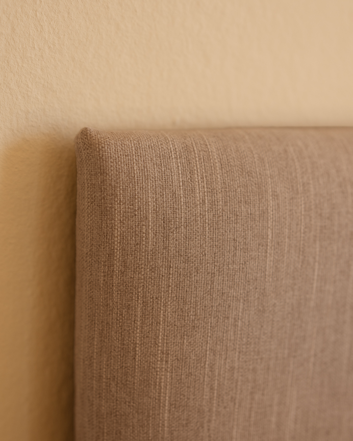 Upholstered polyester headboard with cinnamon-colored buttons available in various sizes.