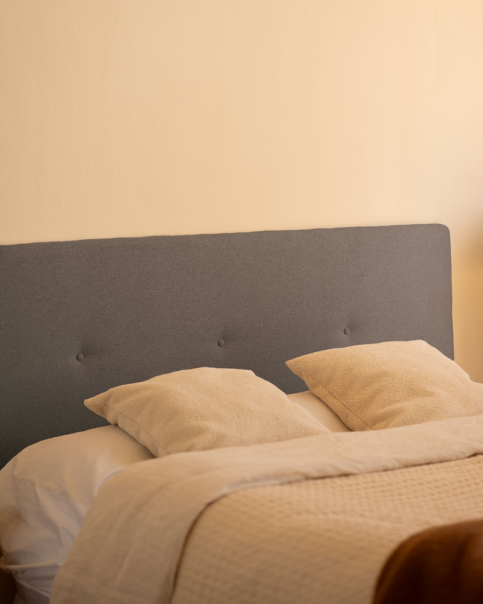 Upholstered polyester headboard with purple button details available in various sizes.
