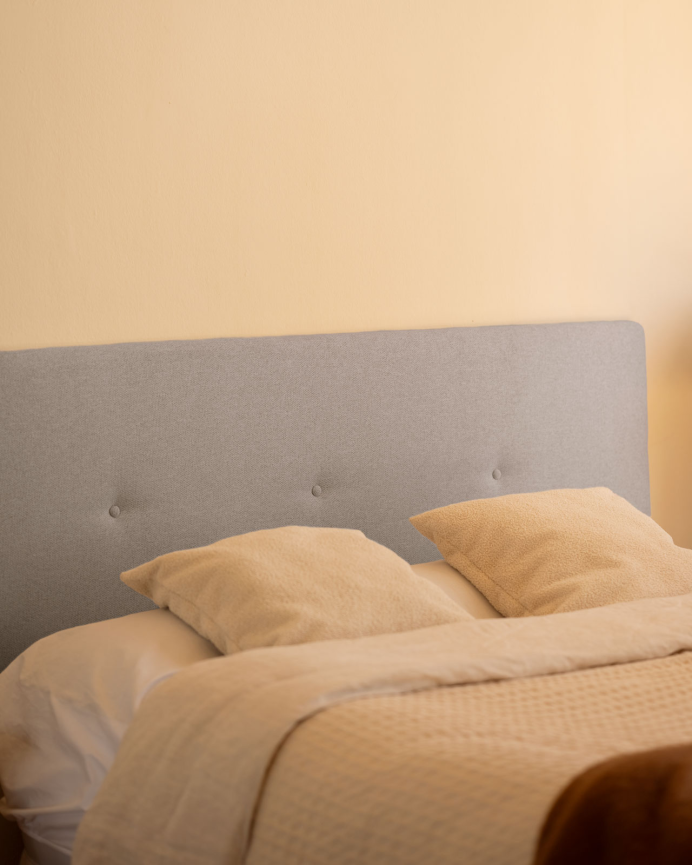 Upholstered polyester headboard with lavender-colored buttons available in various sizes