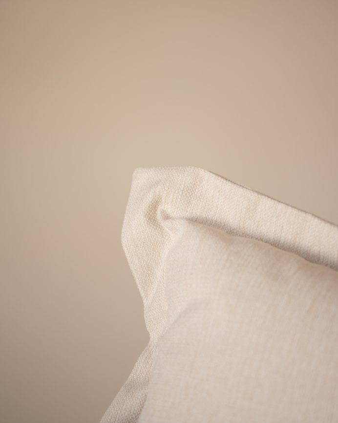 Off-white tone armchair measuring 105x106cm.