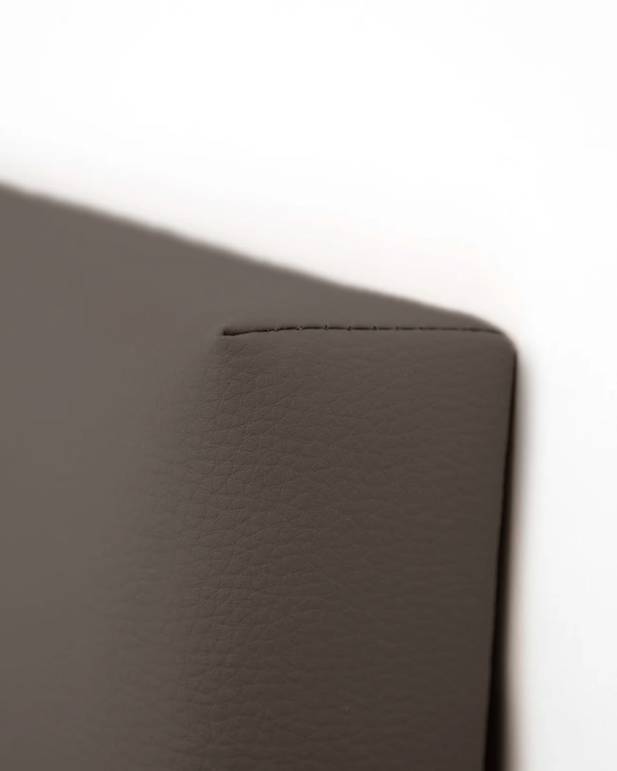 Upholstered headboard in brown faux leather with pleats in various sizes