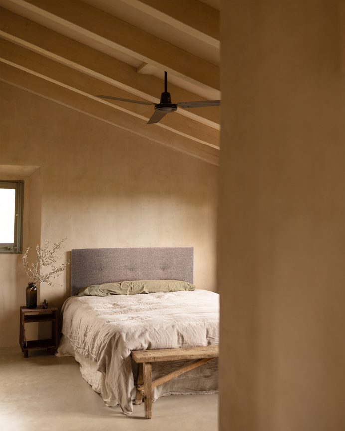 Upholstered polyester headboard with brown button details, available in various sizes.