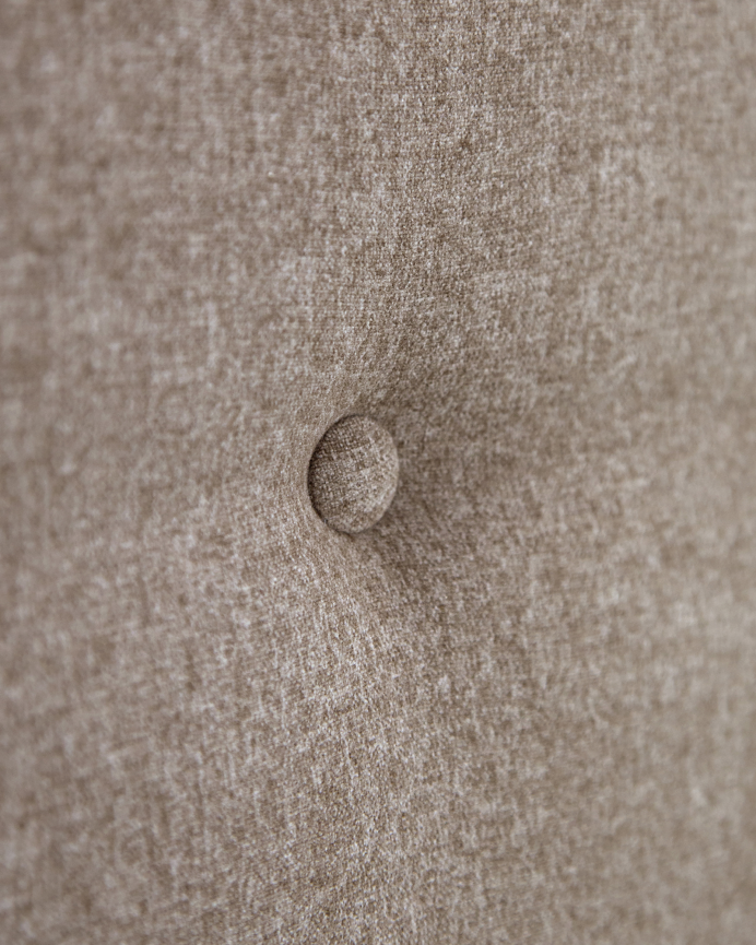 Upholstered polyester headboard with brown button details, available in various sizes.