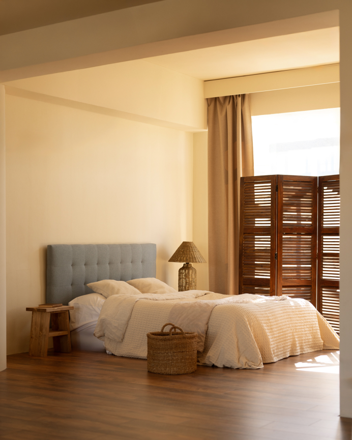 Upholstered polyester headboard with pleats in blue color in various sizes