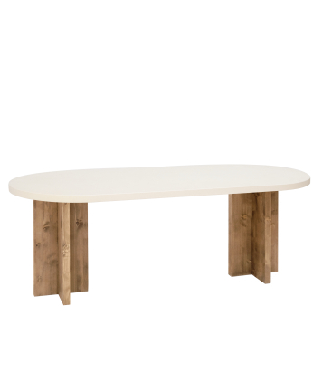 Mesa de comedor ovalada de microcemento en tono blanco roto con patas de madera tono roble oscuro de varias medidas