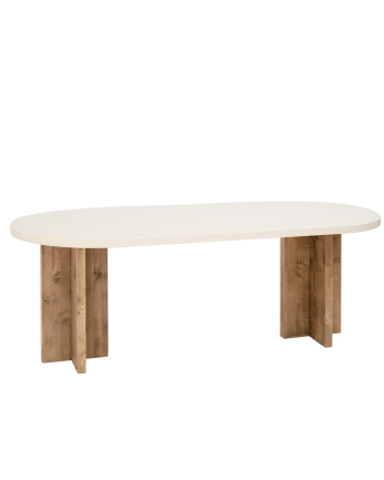 Mesa de comedor ovalada de microcemento en tono blanco roto con patas de madera tono roble oscuro de varias medidas