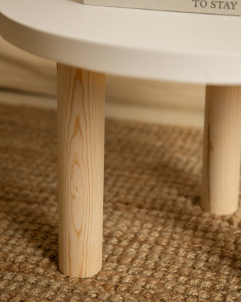 Table basse ronde en bois massif avec plateau en teinte blanche et pieds en teinte naturelle de 40x60cm.
