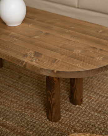 Table basse ovale en bois massif en teinte chêne foncé de 40x120cm.