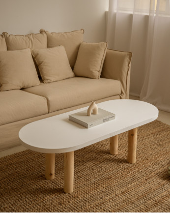 Table basse ovale en bois massif avec plateau en teinte blanche et pieds en teinte naturelle de 40x120cm.