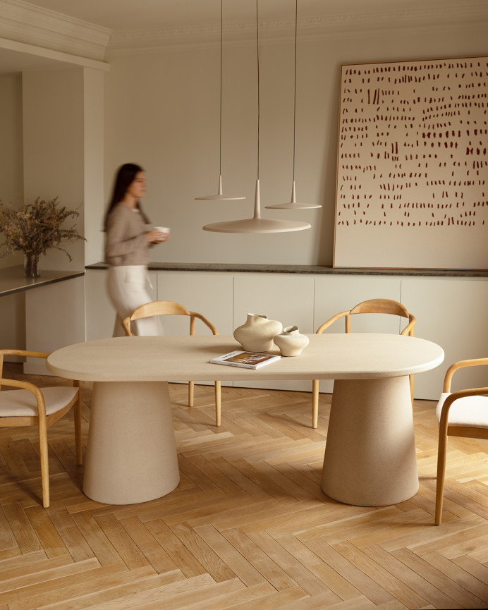 Table de salle à manger ovale en microciment ton beige de différentes tailles