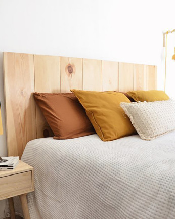 Testata del letto in legno massello in tonalità naturale di varie misure