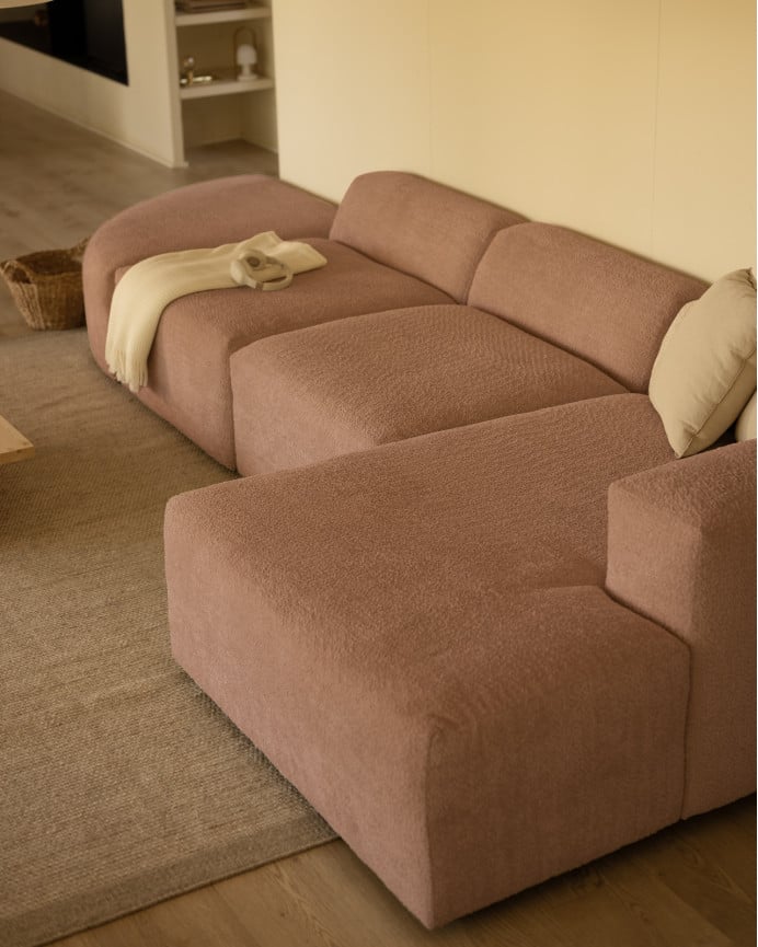 Divano curvo a 4 moduli con chaise longue in bouclé rosa 410x172cm