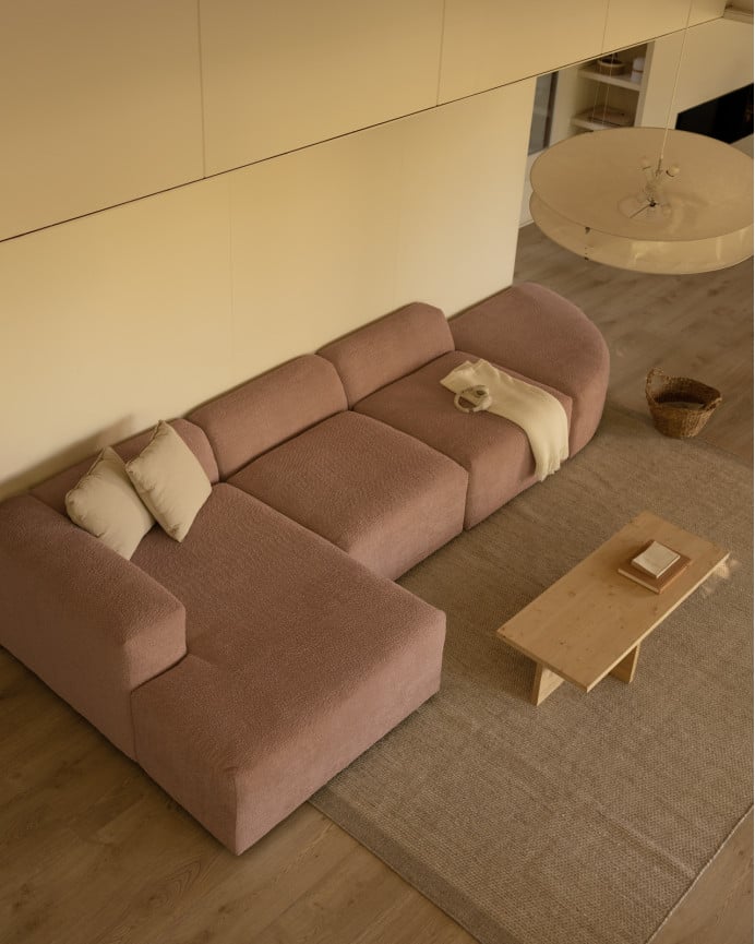 Divano curvo a 4 moduli con chaise longue in bouclé rosa 410x172cm